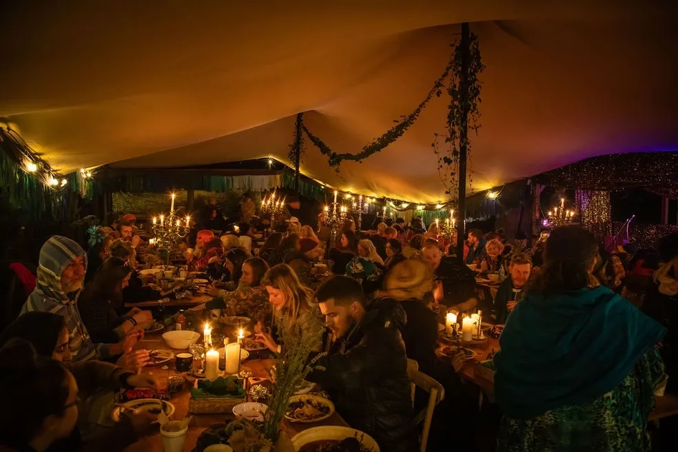 Candlelit banquet under canvas