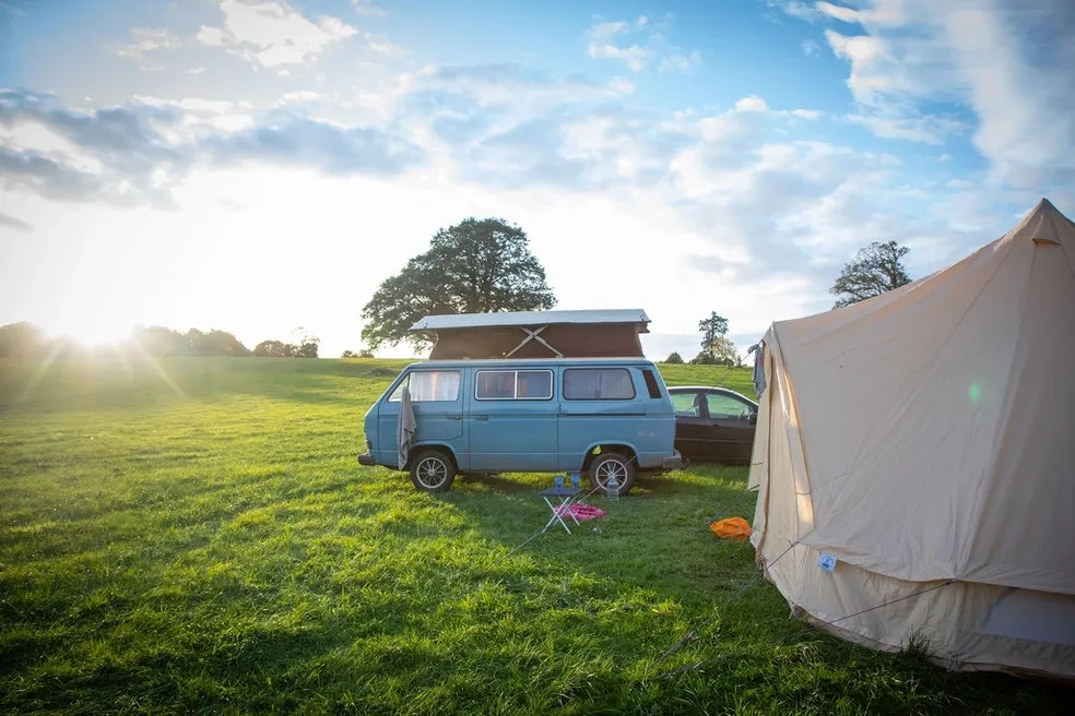 Campervan and bell tent at sunrise