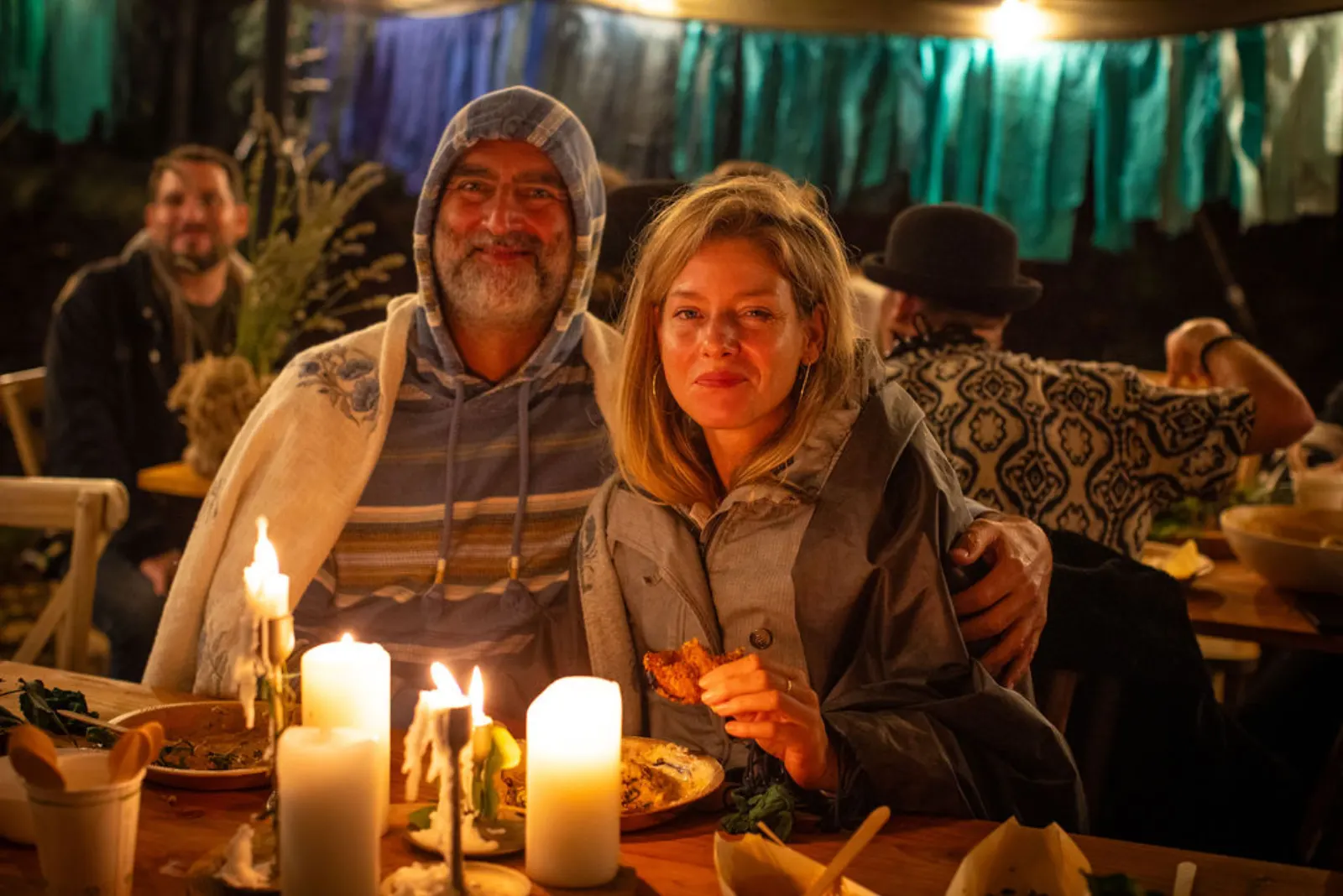 Couple at the candlelit feast