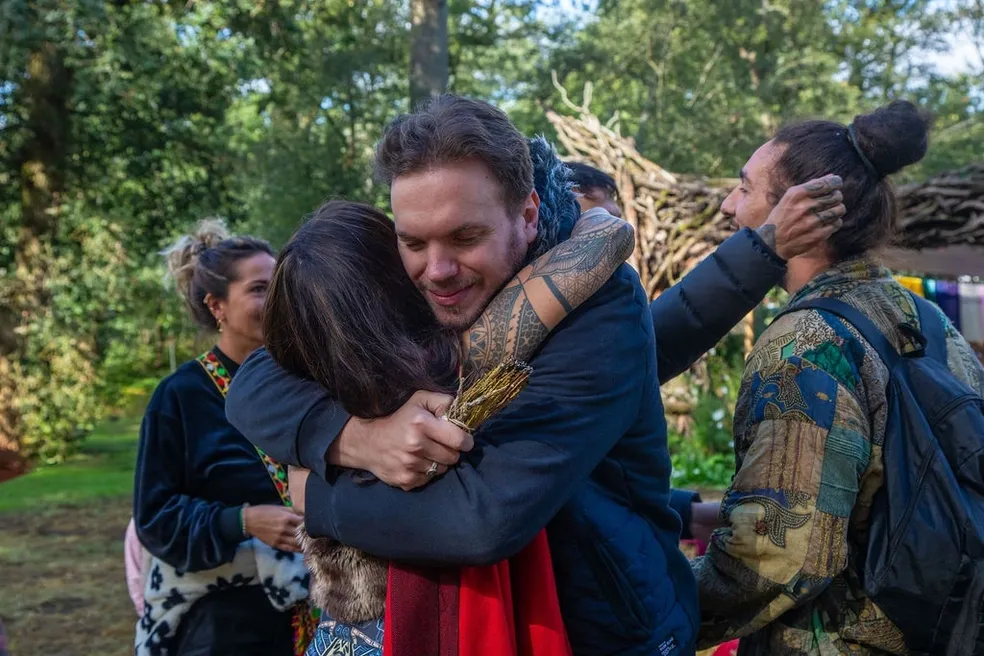 Two people hugging in welcome