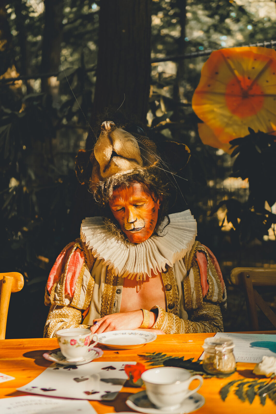 Lion-character in regency dress at the tea ceremony