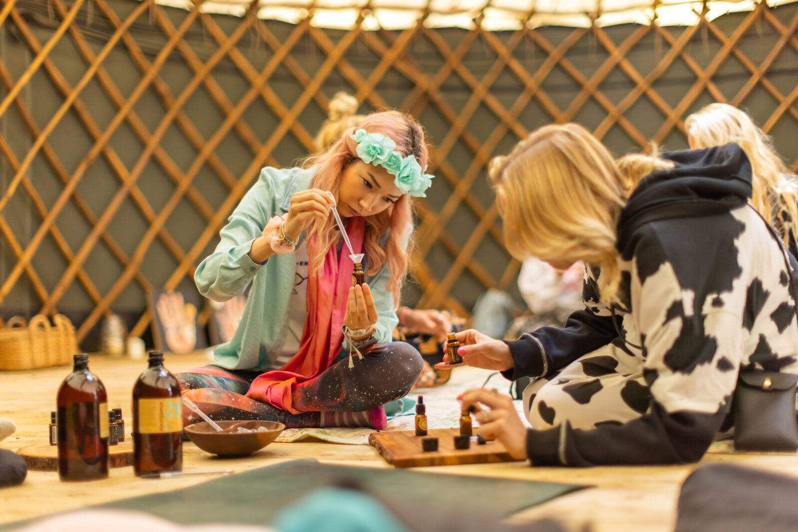 Jewellery-making workshop inside a yurt with crystals and tinctures